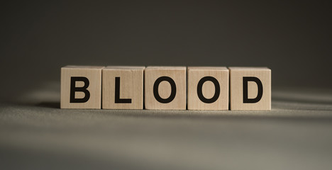 BLOOD word on wooden blocks, background. Medical concept