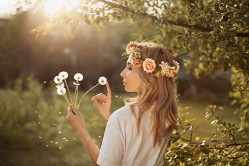 girl forest park nature walk summer dandelions flowers blow cute tree warm nice weather sunny dandelions fly calm wreath hands sunset
