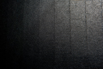 Black texture filled with a light from the top right