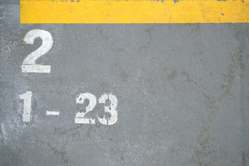 Fototapeta premium Marking at the stadium indicating the places and number. The concept of sport, sporting event. Places for fans and fans. Row 2, places 1 to 23
