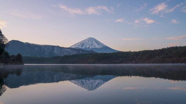 Mt Fuji at Lake Saiko morning sunrise with clouds and reflection