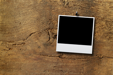 Old panel wood background with pinned polaroid frame. Horizontal, close up, frame mock up