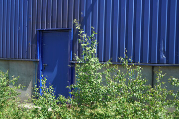 Factory barrels in industrial areas with aluminum as outer cladding photographed in summer
