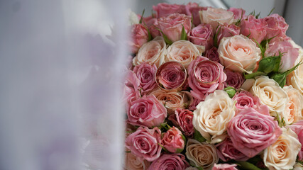 Gold rings on a bouquet of flowers. Groom's morning.
