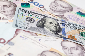 Ukrainian money - hryvnia banknotes USA dollars bills. Finance in Ukraine, of the hryvnia to the dollar exchange rate. Close-up concept finance investment.