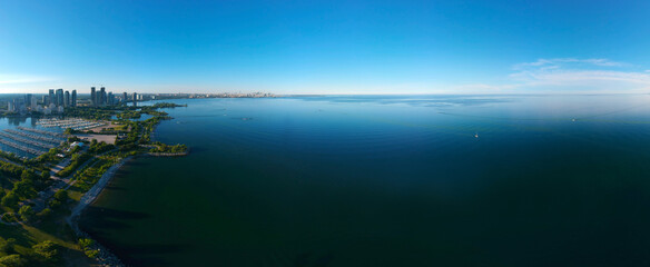 Amazing North American panorama at Humber Bay Shores Park city and green space, skyline cityscape, yacht and boats in azure lake Ontario. Skyscrapers and blue marina, sunset at summer, Ontario, Canada