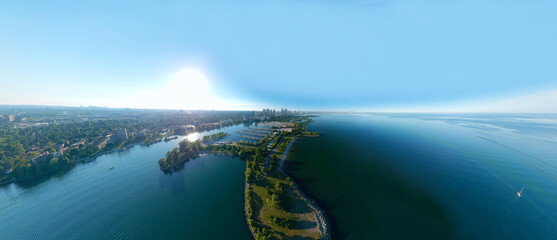 Amazing North American panorama at Humber Bay Shores Park city and green space, skyline cityscape, yacht and boats in azure lake Ontario. Skyscrapers and blue marina, sunset at summer, Ontario, Canada
