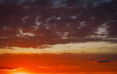 Beautiful Twilight sky background. Colorful Fiery orange and red sunset sky.