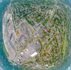 Artistic view of North American city at summer season from above. Many low and high rise houses and skyscrapers condominiums, stores, facilities, busy streets in Toronto, Ontario, Canada.