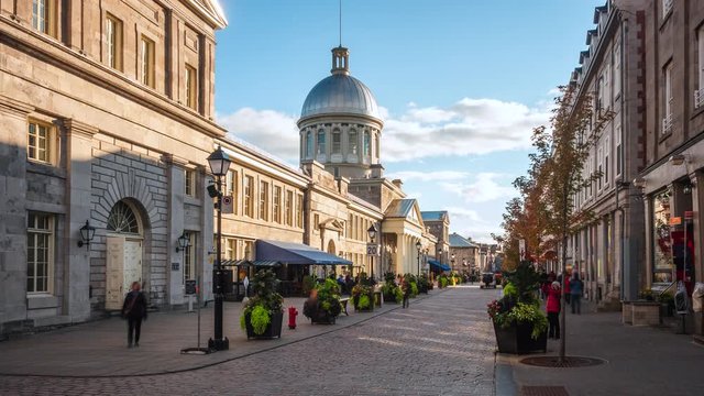 Zoom in timelapse view of historical landmark Bonsecours Market in the heart of Old Montreal on a sunny day in Montreal, Quebec, Canada.