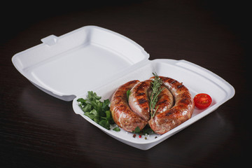 grilled pork on a bone with vegetables on a plate