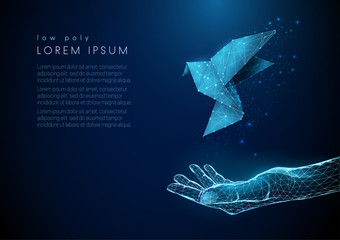Abstract open hand with flying paper bird
