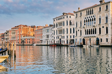 Palace in Venetian style on the Grand Canal in sunrise time. Venice, Italy.