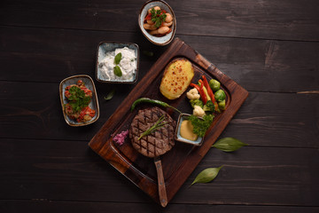 vegetables alongside grilled meat
