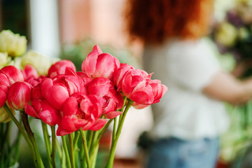 Fresh blooming flowers in a flower shop (roses, peonies)