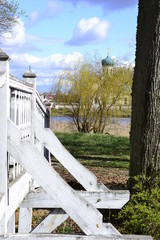 Wooden bridge and domes of St. Nicholas Church. Stankovo, Belarus.
