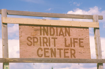 Wooden sign reads Indian Spirit Life Center in Southwestern United States