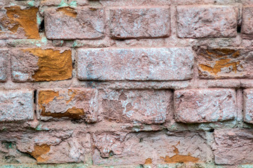 old brickwork of the wall, red-tinged texture