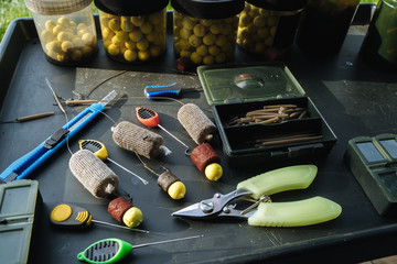 Bait and accessories for fishing on the table