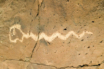 Native American petroglyphs featuring an image of a snake at Petroglyph National Monument, outside Albuquerque, New Mexico