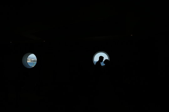The guy with the girl looks one on one in a yacht with a sea view.