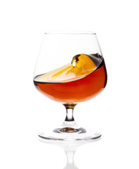 Glass glass with whiskey on a white highlighted background