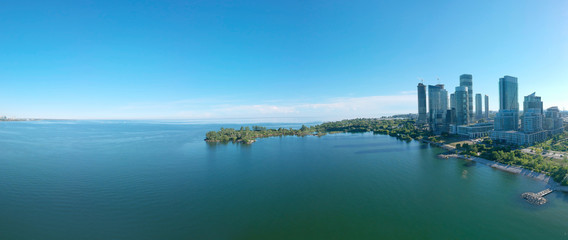 Panorama of Humber Bay Shores Park city view, green space with skyline cityscape downtown. Skyscrapers over The Queensway on sunset at summer time, near Etobicoke or New Toronto, Ontario, Canada