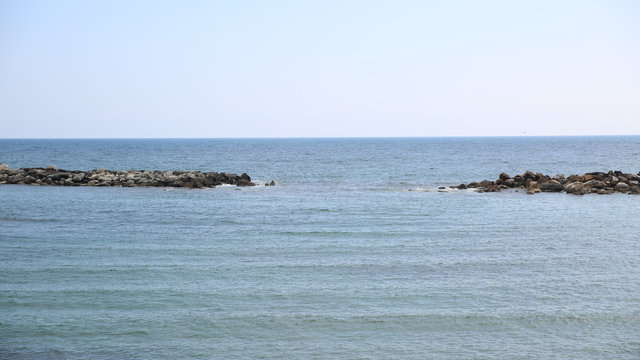 Beautiful sea with stones in Italy.