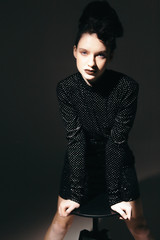 Art portraits of fashion girls in dress with hairstyle and makeup in vintage style in the studio on a white background