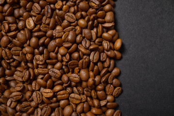 Texture of coffee beans. Roasted coffee beans background. close up Coffee beans with copy space on Black background