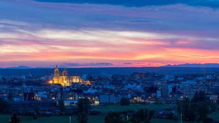 Fototapeta na wymiar Panoramic photograph of the city of León, Spain. Taken between the end of the golden hour and the start of the blue hour