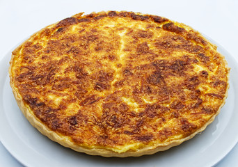 Homemade Quiche Lorraine isolated on white background