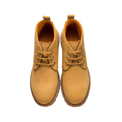 autumn hiking boots in tan with lace-up tread isolated on a white background