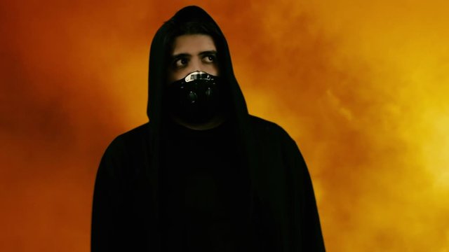 masked man in smoke with face mask