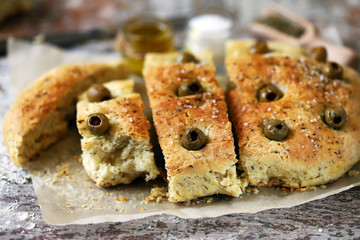 Traditional italian bread with olives and spices. Focaccia.