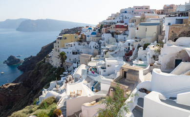 Greek village on volcanic cliffs along ocean, Oia, Santorini, Greece