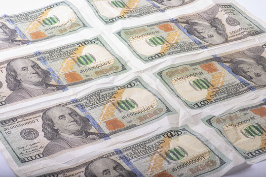 Napkin with the image of hundred-dollar bills. Matrix of money. Money background. Printing of money.
