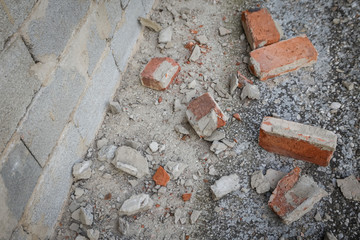 Scattered and damaged bricks on the balcony