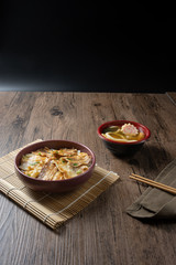 Butadon, Japanese rice bowl dish consisting of bowl of rice topped with pork belly simmered surved with with Japanese oden soup.