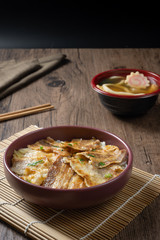 Butadon, Japanese rice bowl dish consisting of bowl of rice topped with pork belly simmered surved with with Japanese oden soup.
