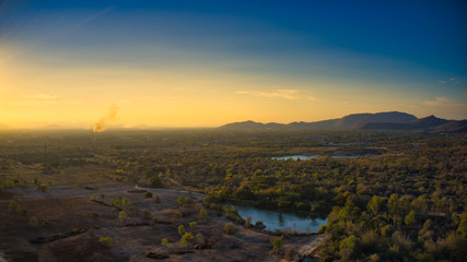 This unique photo shows the hilly landscape with lakes, from hua hin thailand, taken with a drone during a fantastic sunset!