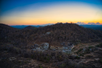 This unique photo shows the hilly landscape, from hua to thailand, taken with a drone by the evening sun during a wonderful sunset!