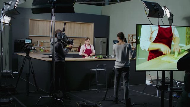 WIDE Behind the scenes of studio set, shooting TV television cooking show featuring celebrity chef, professional TV production. Shot on ARRI Alexa Mini