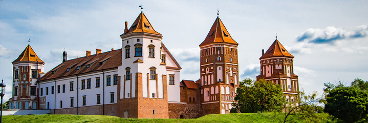 Mir, Belarus. Medieval castle on a background of blue sky. Summer panoramic landscape, ancient...