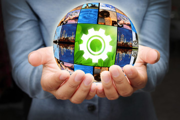 Gear and industrial spherical shape on the hand holding