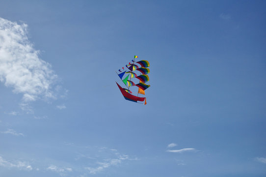 Creative art and colorful kite sail ship image style for sale and playing at Kuta Beach in Bali, Indonesia