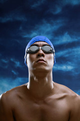 Man with swimming cap and goggles