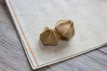 Chocolate meringues cookie dessert on the table close up 
