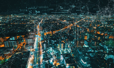 Technology links with aerial cityscape view of Japan at night