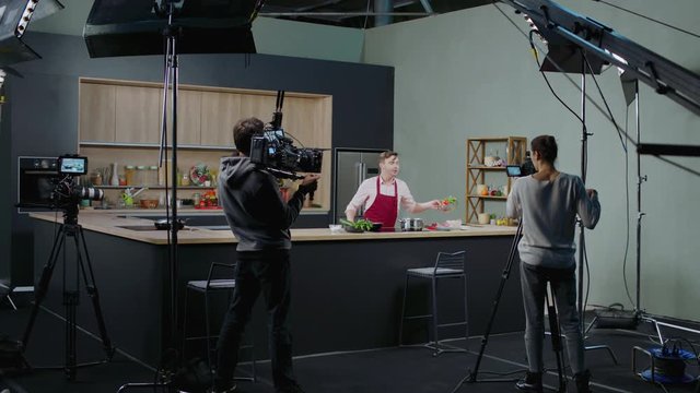 WIDE Behind the scenes of studio set, shooting TV television cooking show featuring celebrity chef, professional TV production. Shot on ARRI Alexa Mini